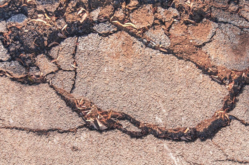 Cracked asphalt holes road old area background stock photo