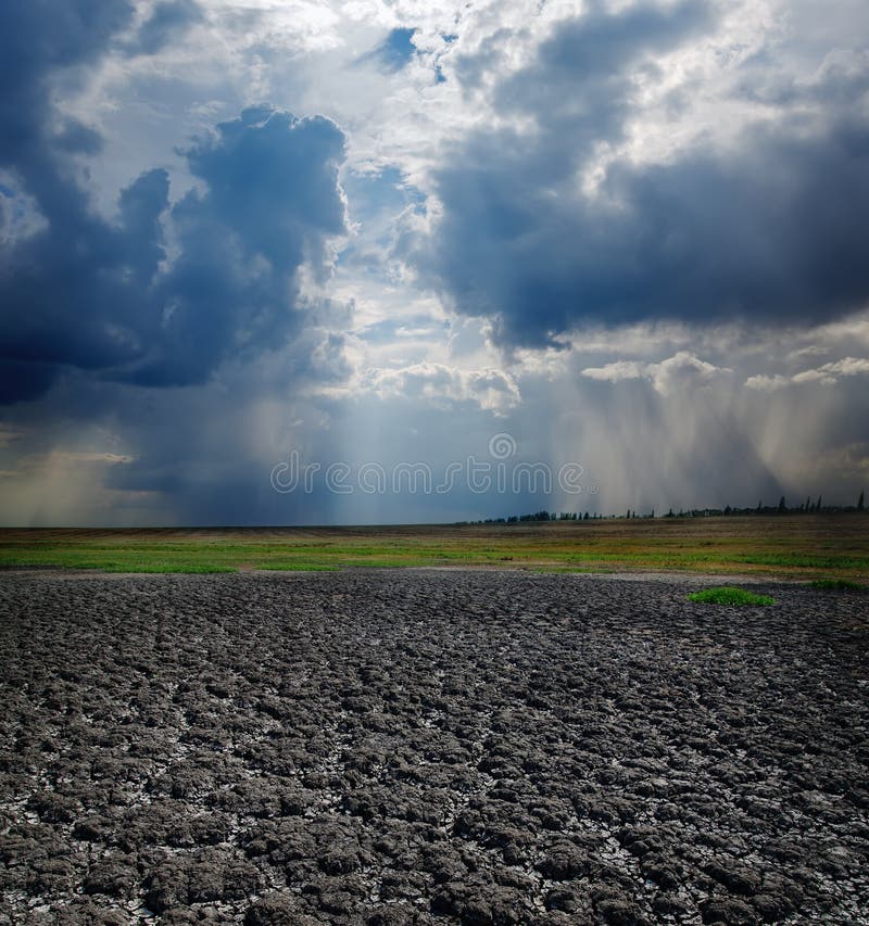 Cracked earth and dramatic sky