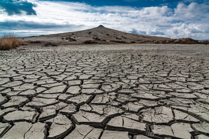 Cracked earth at the foot of a mud volcano