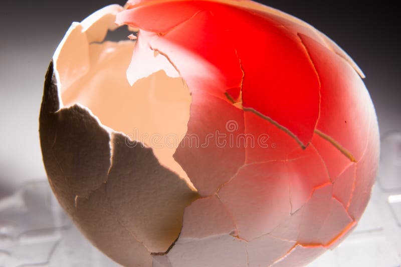 Cracked eggshell lined with red, concept against abortion and bad attitude to animals stock photos Cracked eggshell lined with red, concept against abortion and bad attitude to animals stock photos