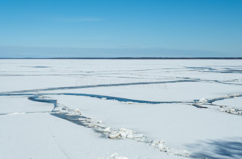 Cracked lake ice on a clear sunny very cold day. royalty free stock photography