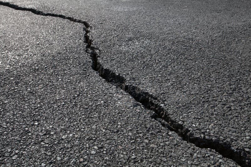 Cracked asphalt pavement, close-up. Cracked asphalt pavement, close-up.