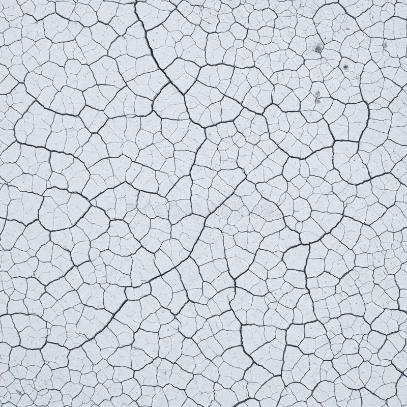 Cracked white surface resembling dried mud or a desiccated lake bed. The image royalty free illustration