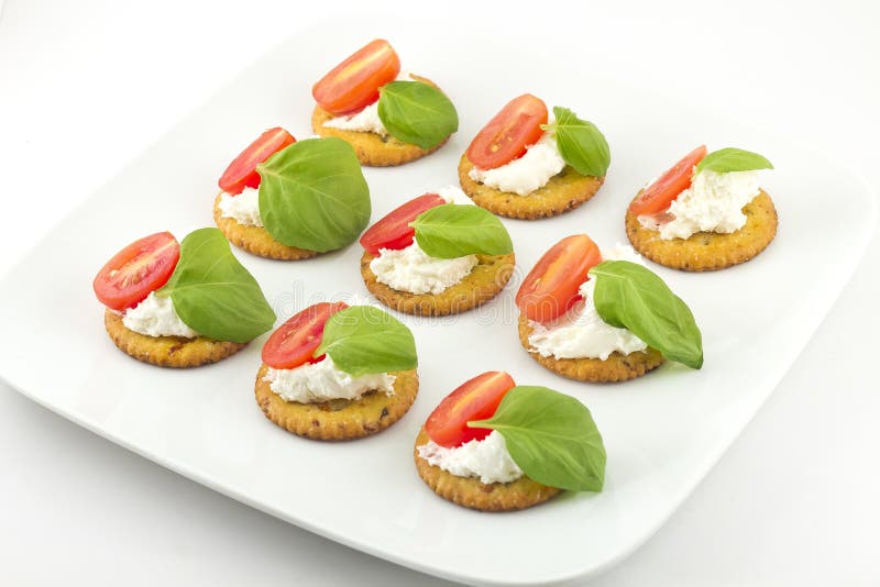 Crackers with Cheese Tomato and Basil Stock Photo Image of food