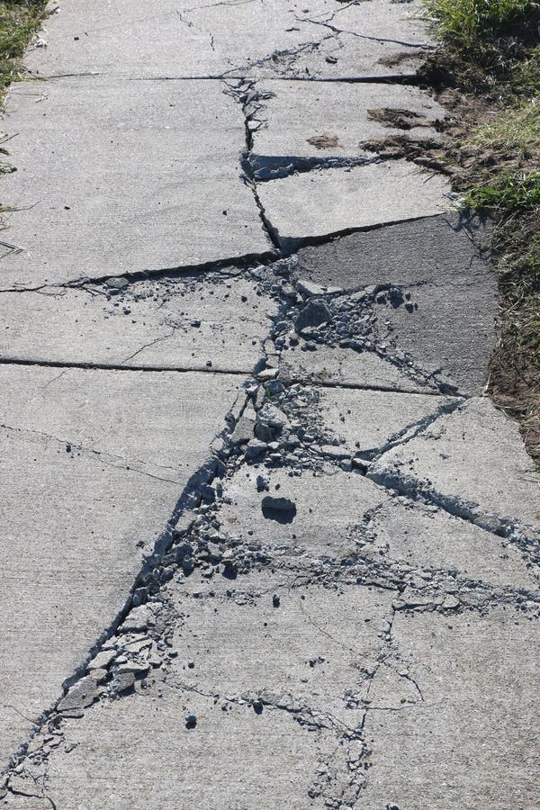 Cracks in the sidewalk stock image. Image of sidewalk - 162779681