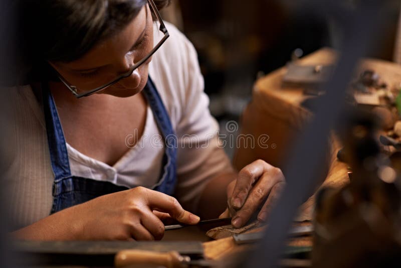 Crafted with care. An artist creating something out of wood. stock photo