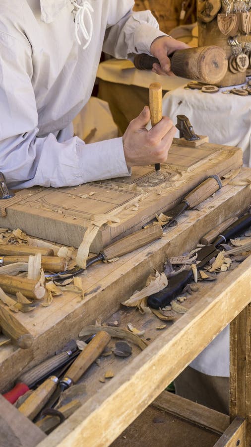 Craftsman Carving Wood in a Medieval Fair, Carpentry Tools Stock Image Image of wood