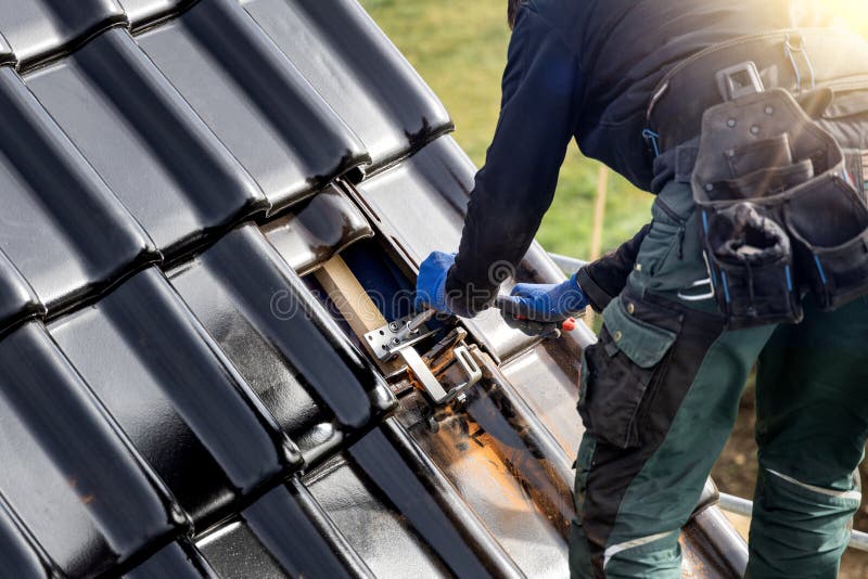 Craftsman fastening a bracket for a solar panel mounting system