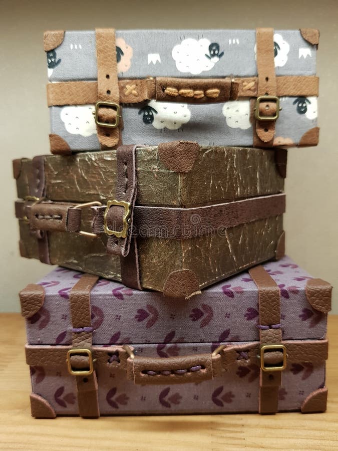 Craftsman makes miniature doll suitcases stock image