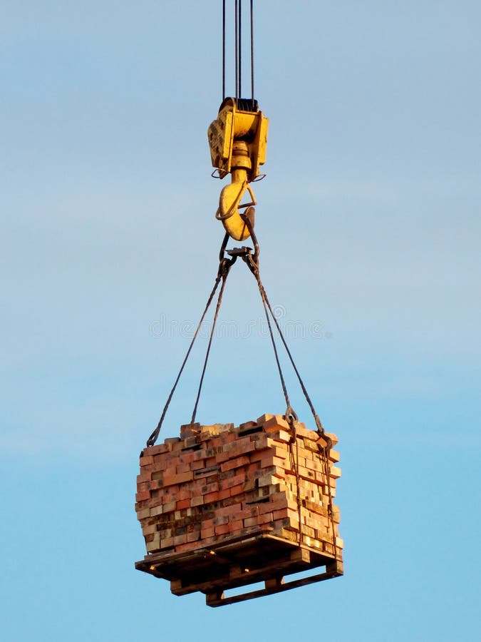 Crane lifting a box stock photo. Image of lifting, organization 5316824