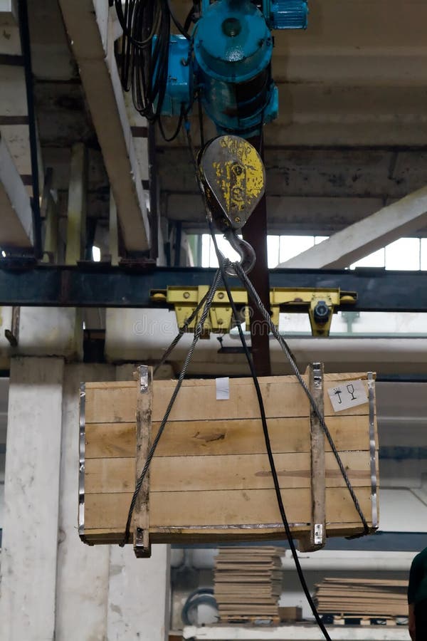 Crane lifting a box stock photo. Image of lifting, organization 5316824