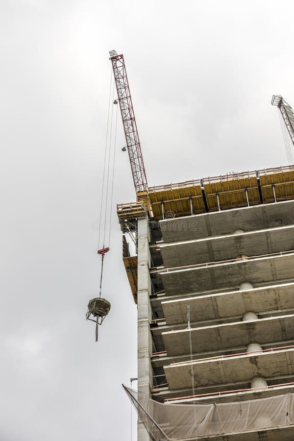 Crane Lifting Concrete Bucket Stock Image Image of machine, cable