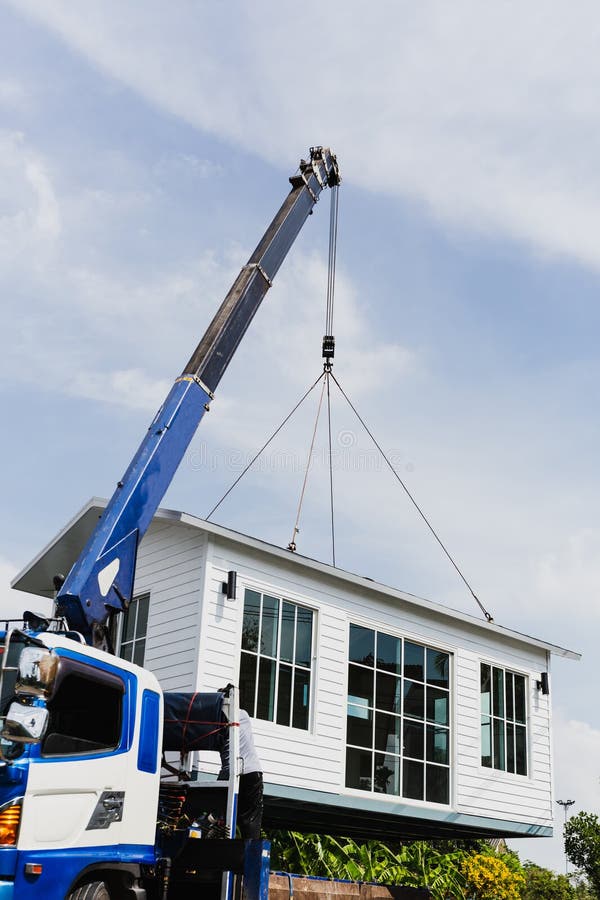 Crane Lifting a Knock Down Private House. Stock Photo Image of heavy