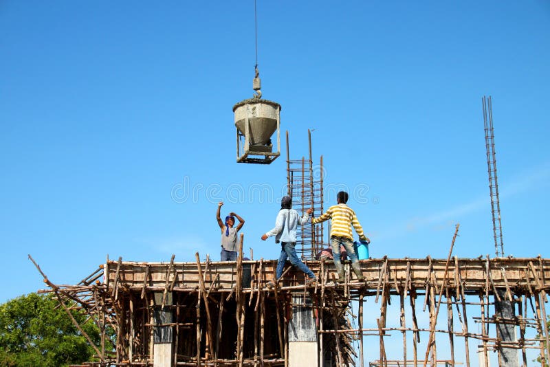 Crane lifting mixed concrete container stock photography Crane lifting mixed concrete container stock photography