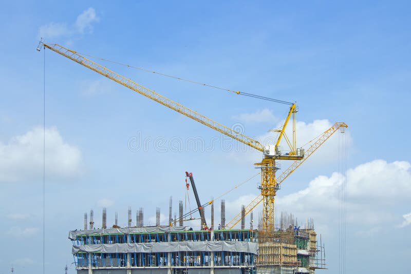 Crane Lifts Building with Construction Workers Stock Photo Image of