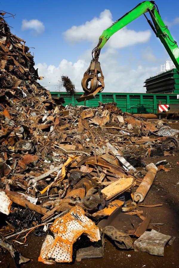 Crane loading a ship with recycling steel