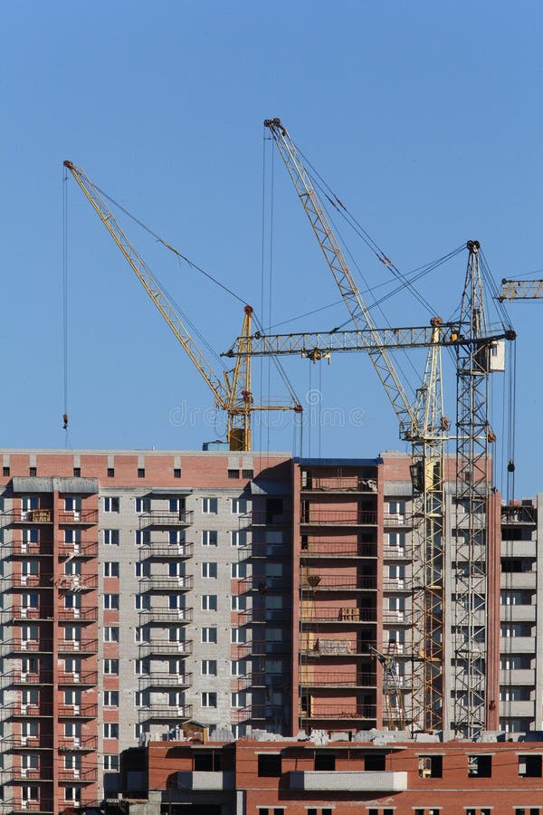 Cranes are Building a House Stock Photo Image of apartment, blue