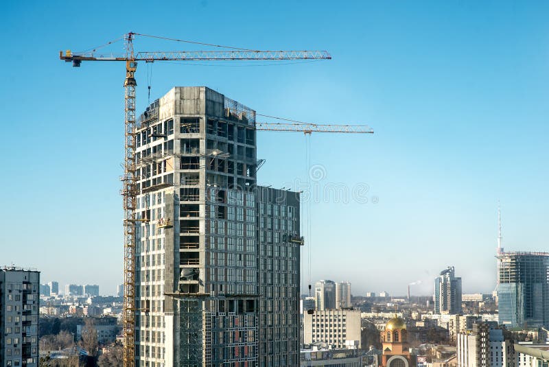 Cranes and housing estate stock image. Image of residential 89659727