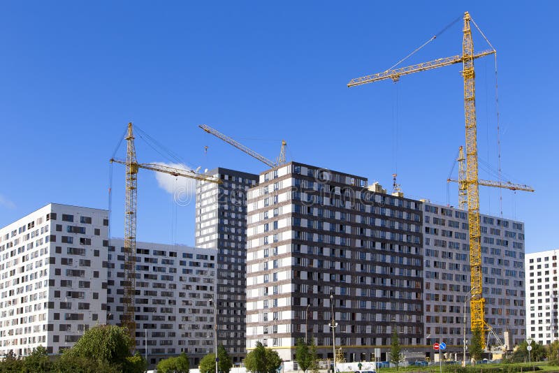 Cranes Over the House Under Construction .. Stock Photo Image of