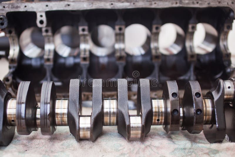 Crankshaft Car Closeup Against a Dismantled Engine Stock Photo Image