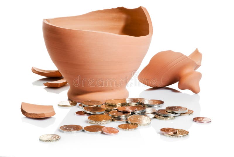 Broken moneybox and coins isolated over white background. Broken moneybox and coins isolated over white background
