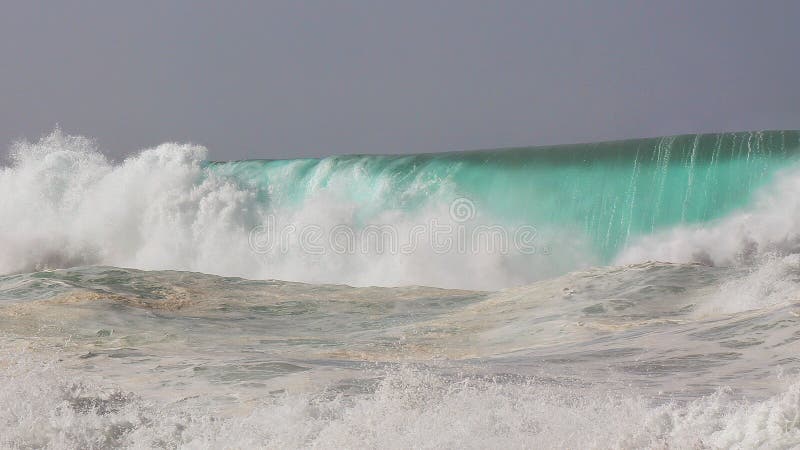 Aqua blue barrel rolls to shore during a massive winter swell on Oahu's north shore. Aqua blue barrel rolls to shore during a massive winter swell on Oahu's north shore