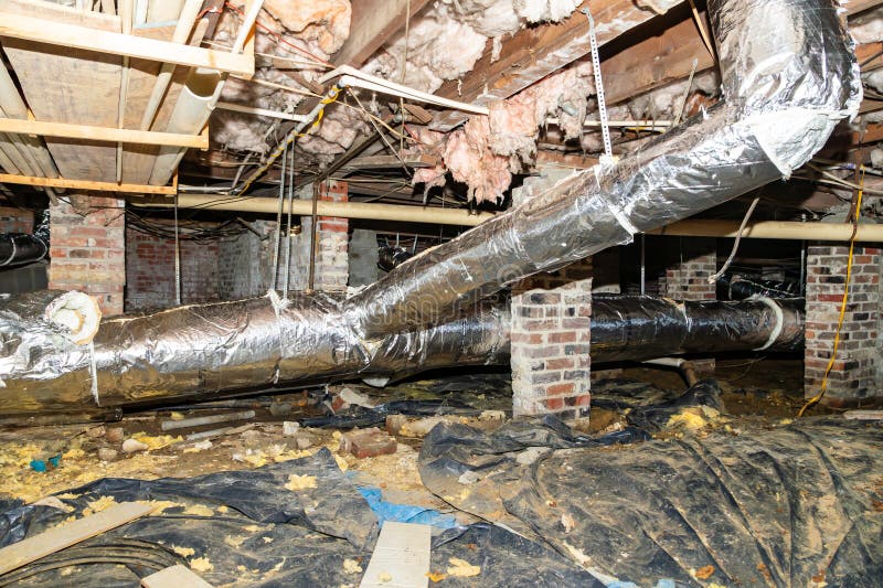 Crawl Space under house with air conditioner duct work and insulation