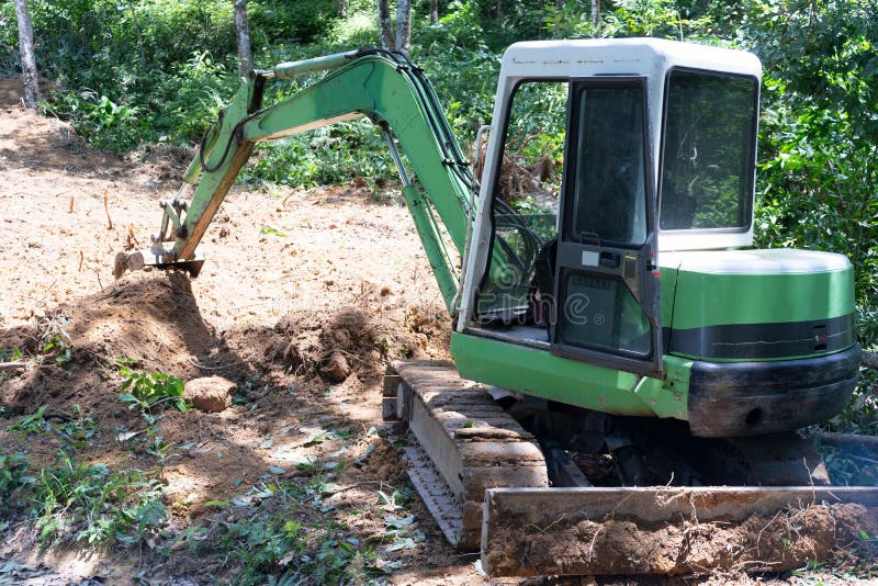 Crawler Excavator Digging on Mountain Equipment for Construction Stock