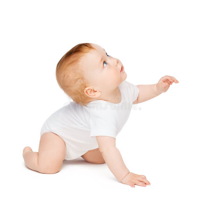 Crawling curious baby looking up stock photos