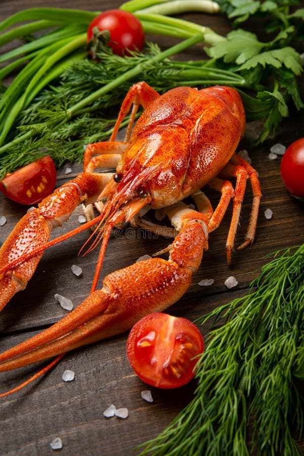 Crayfish. Red boiled crawfishes on table in rustic style, closeup. Lobster closeup.