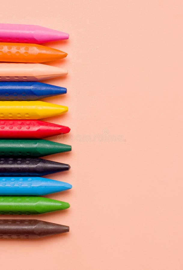 Crayons on a beige background. Drawing concept royalty free stock photography