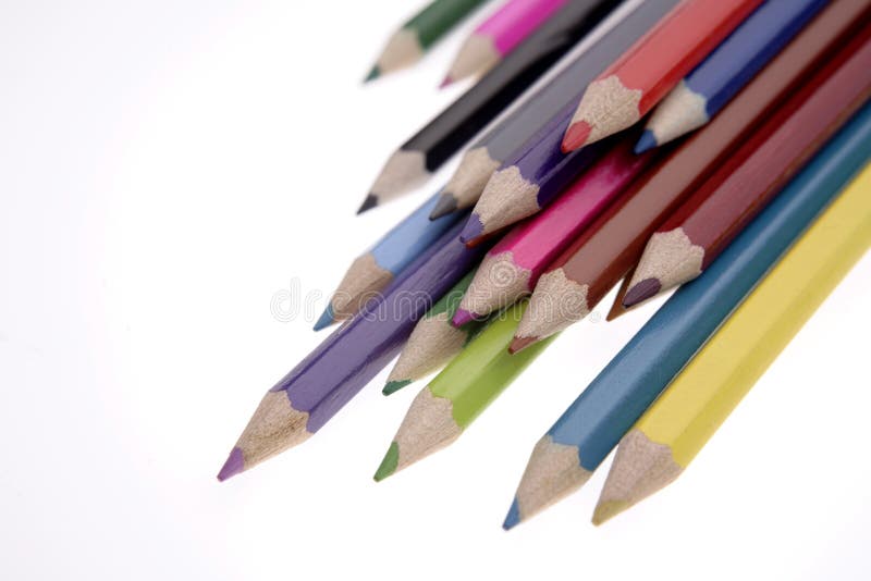 Colored pencils on white background. Colored pencils on white background