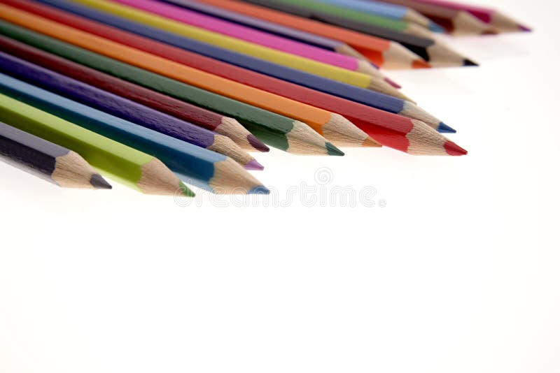 Colored pencils on white background. Colored pencils on white background