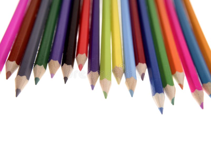 Colored pencils over white background. Colored pencils over white background