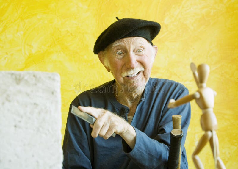 Crazy Artist with a Wooden Figure Model Stock Photo - Image of think