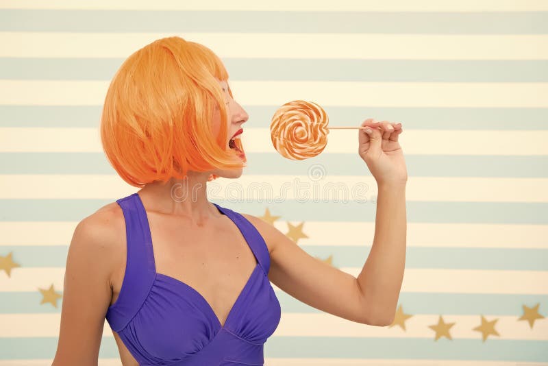 Crazy girl in playful mood. Cool girl with lollipop. Sexy woman. happy pinup model with lollipop in hand. Fashion girl royalty free stock photos Crazy girl in playful mood. Cool girl with lollipop. Sexy woman. happy pinup model with lollipop in hand. Fashion girl royalty free stock photos