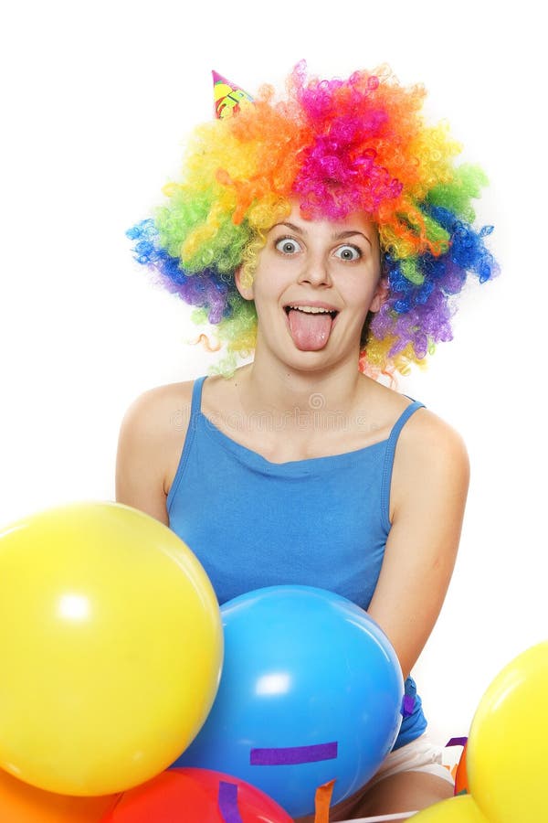 Crazy happy woman with colored hair over white