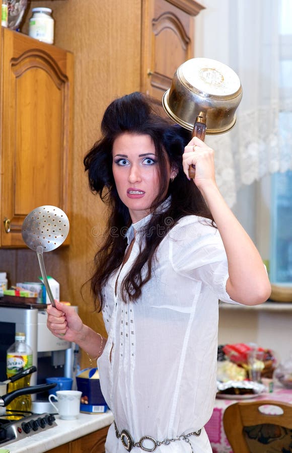 Crazy Housewife on the Kitchen Stock Ph
