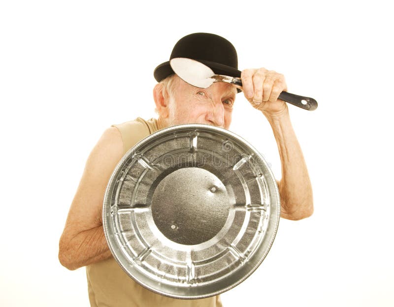 Crazy Man Defending Himself with Can Lid and Spoon Stock Photo Image