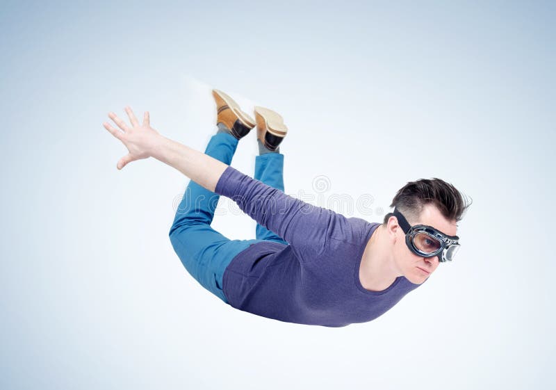 Crazy man in goggles is flying in the sky. Jumper concept stock photo Crazy man in goggles is flying in the sky. Jumper concept stock photo