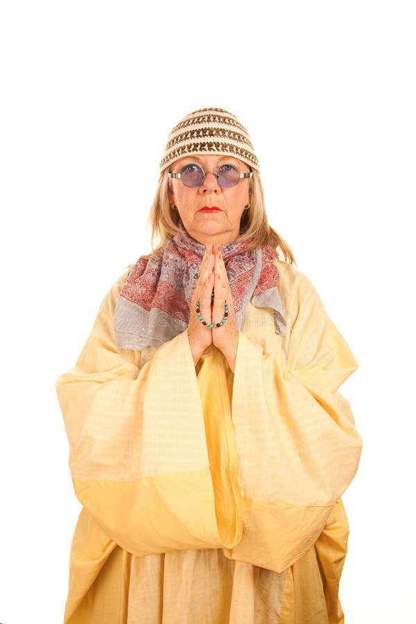 Crazy new age woman in a yellow robe stock photography