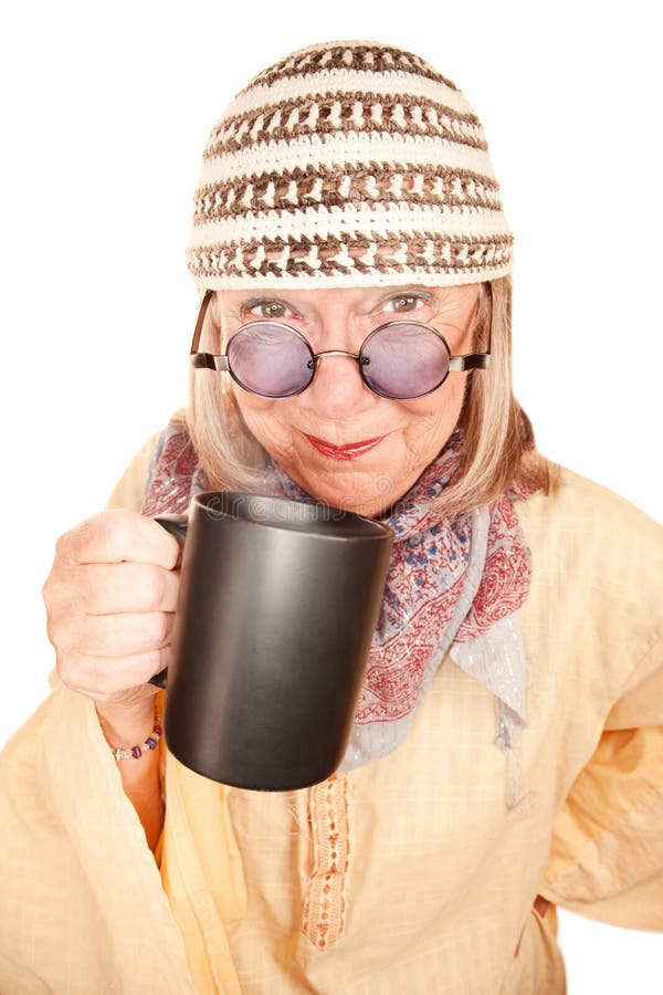 Crazy new age woman in a yellow robe with coffee royalty free stock image