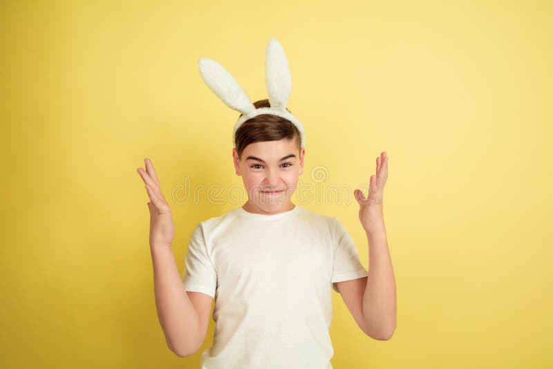 Easter Bunny Boy with Bright Emotions on Yellow Studio Background Stock ...