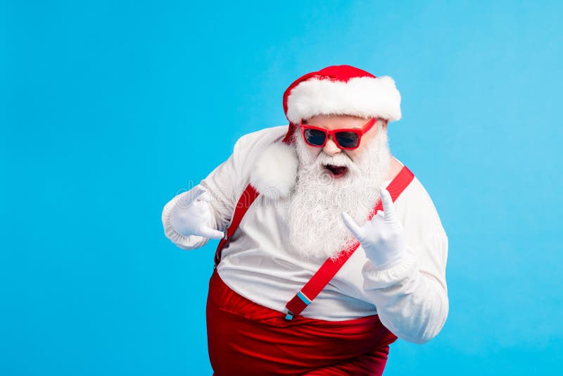 Crazy stylish santa claus with big stomach beard show horns symbol x-mas christmas jolly fun wear style trendy royalty free stock photo