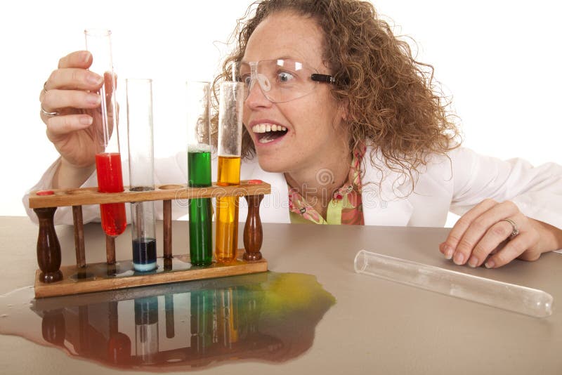 Crazy woman scientist with test tubes grab red