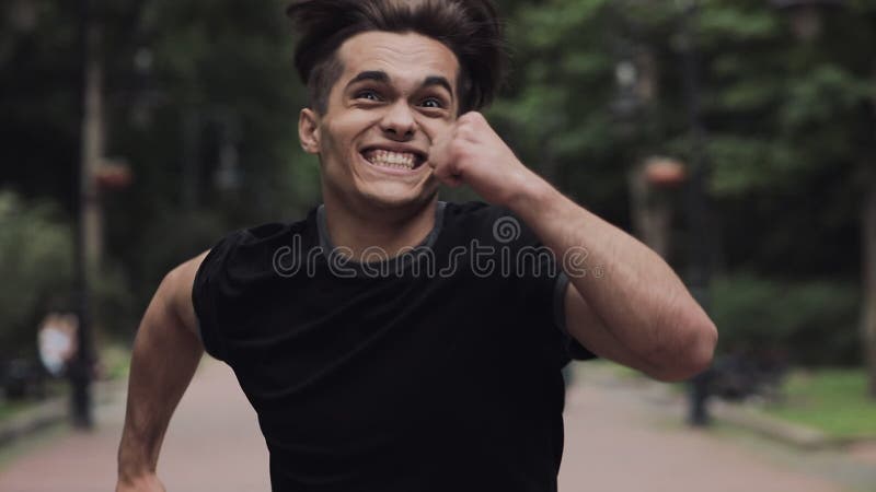 Crazy Young Handsome Funny Man Running on the Park Background Close Up Slow Motion. Stock Footage - Video of mobilephone, cellphone: 156487762 Crazy Young Handsome Funny Man Running on the Park Background Close Up Slow Motion. Stock Footage - Video of mobilephone, cellphone: 156487762