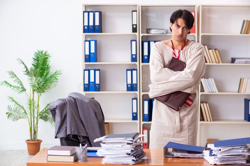 Crazy young man in straitjacket at the office stock photos Crazy young man in straitjacket at the office stock photos
