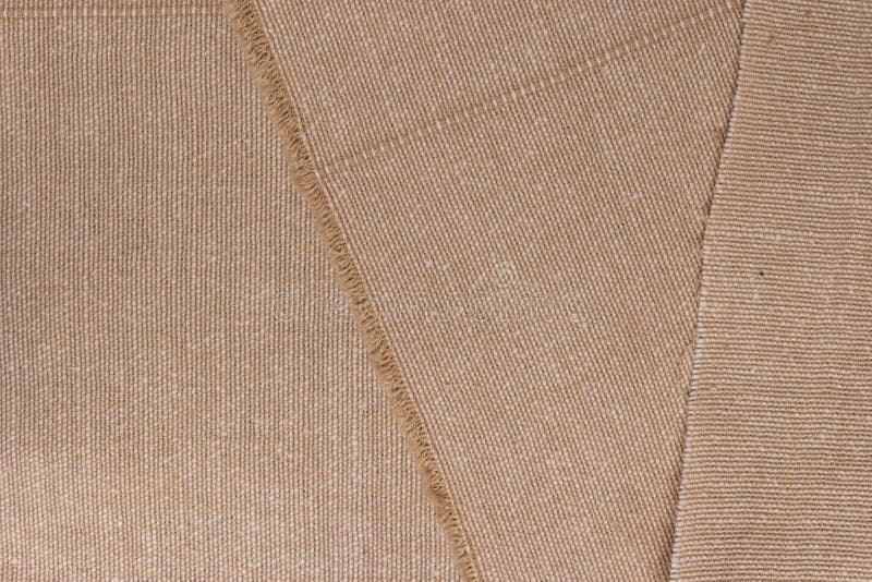 Cream abstract hessian or sackcloth fabric or hemp sack texture background. Beige wall of artistic wale linen canvas seamless.