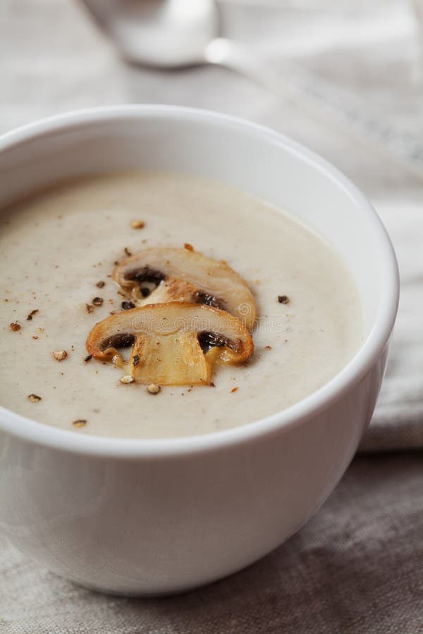 Cream soup with mushrooms champignon and potato in white bowl stock images Cream soup with mushrooms champignon and potato in white bowl stock images