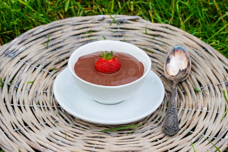 Creamy chocolate pudding on grey wicker tray